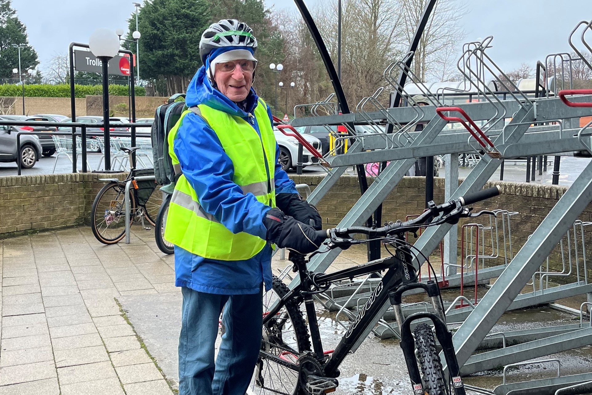 Edinburgh resident Michael Owen, 89, parks his bike at the local supermarket